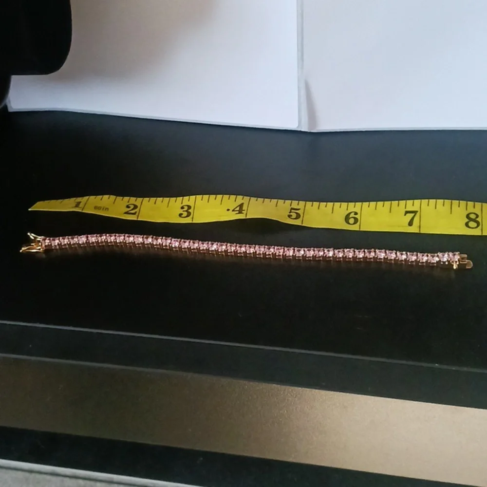 Elegant Gold Tone Bracelet with Pink Stones